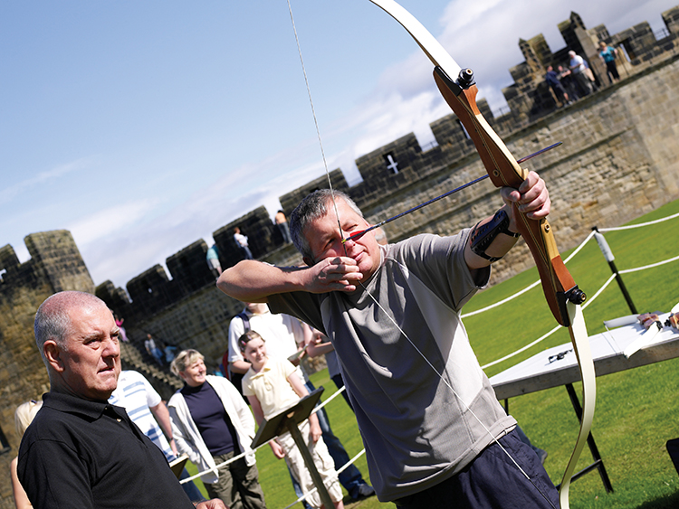 Archery Visitor Firing Arrow