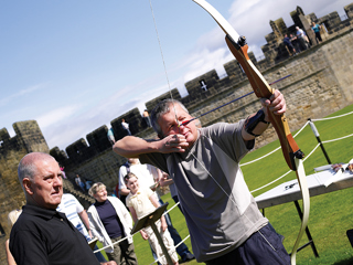 Archery Visitor Firing Arrow